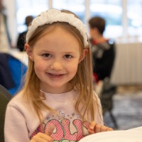 Little girl smiles with her cookies